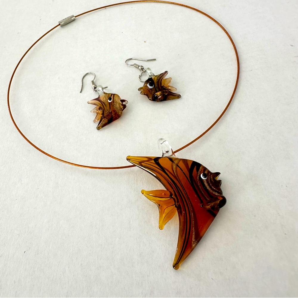 Glass pendant on the string and matching pair of earrings
